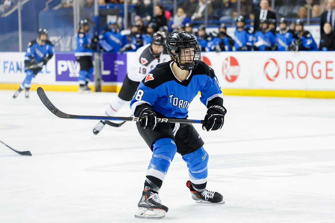 Kaitlin Willoughby on the ice playing in the PWL